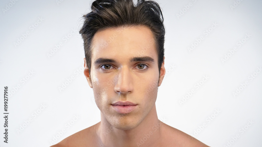 Close up of a man's face after hydrating his skin and protects against impurities with anti-aging effects. Concept of: beauty and body care, creams, skincare