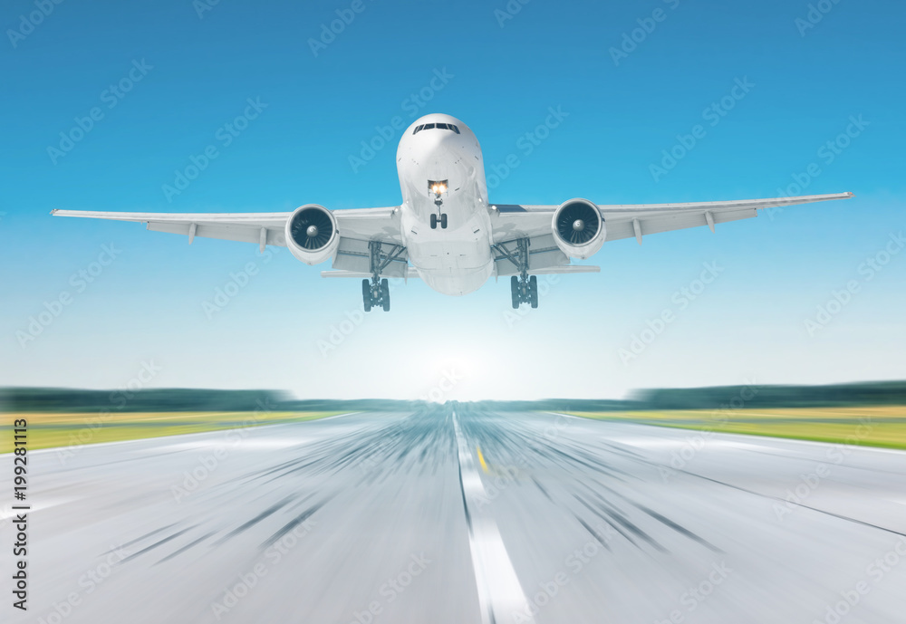 Obraz premium Airplane flying departure landing speed motion on a runway in the clear sky bright day.