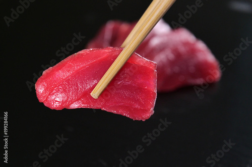  Macro shot of sushi, sashimi, uramaki and nighiri. typical Japanese dish consisting of rice, salmon or tuna,shrimp and fish eggs soaked in soy. Concept: Japanese restaurant, sushi,  photo