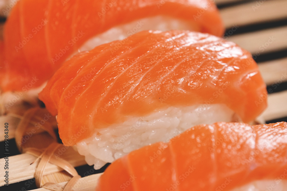 Macro shot of sushi, sashimi, uramaki and nighiri. typical Japanese dish consisting of rice, salmon or tuna,shrimp and fish eggs soaked in soy. Concept: Japanese restaurant, sushi, Macro shot of sushi, sashimi, uramaki and nighiri. typical Japanese dish consisting of rice, salmon or tuna,shrimp and fish eggs soaked in soy. Concept: Japanese restaurant, sushi,
