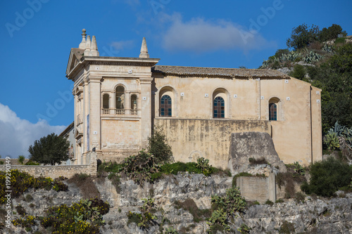 Side view of the Rock Church of the Rosary (Chiesa Rupestre del Rosario) and convent in Scicli, Sicily