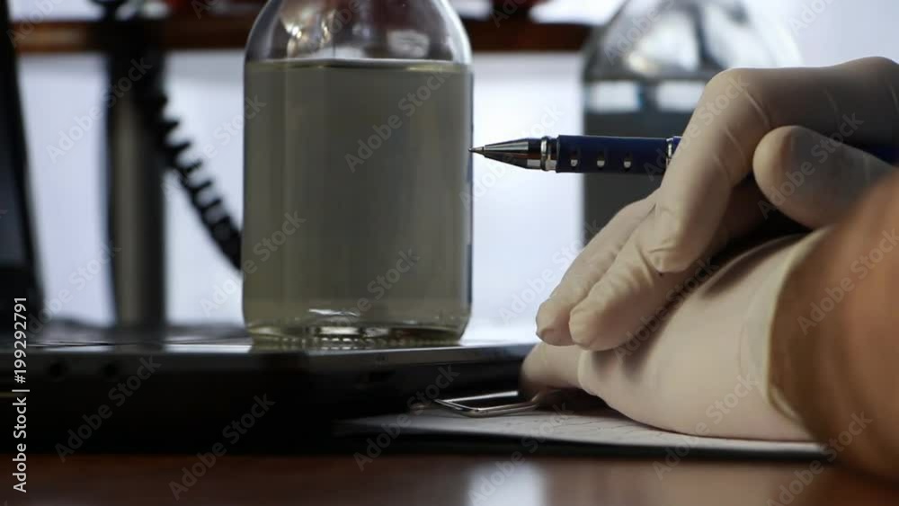 the doctor sits at the desktop and thinking what to do next