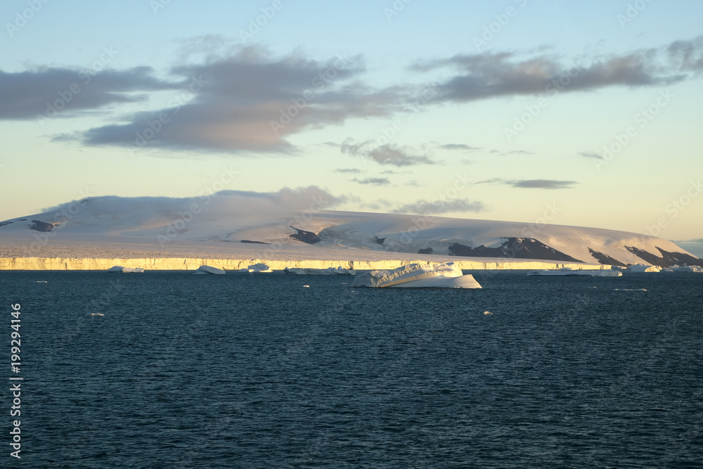 Paulet Island Antarctica, late afternoon landscape with sunlight on glacier edge