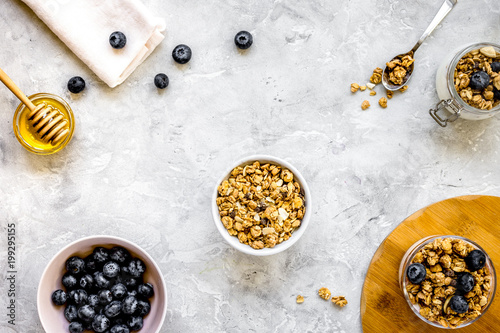 Oat flakes and berries granola glass on table background top vie