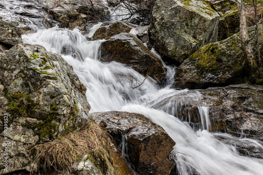 Waterfall from snow melt in the mountains of Madrid, Spain Waterfall from snow melt in the mountains of Madrid, Spain