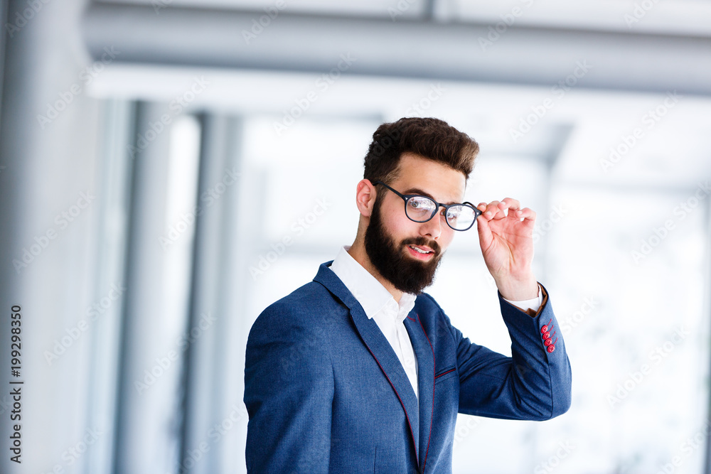 Young Handsome Businessman Posing At Workplace Young Handsome Businessman Posing At Workplace