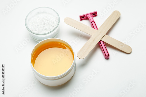 Tools for depilation on a white background, top view