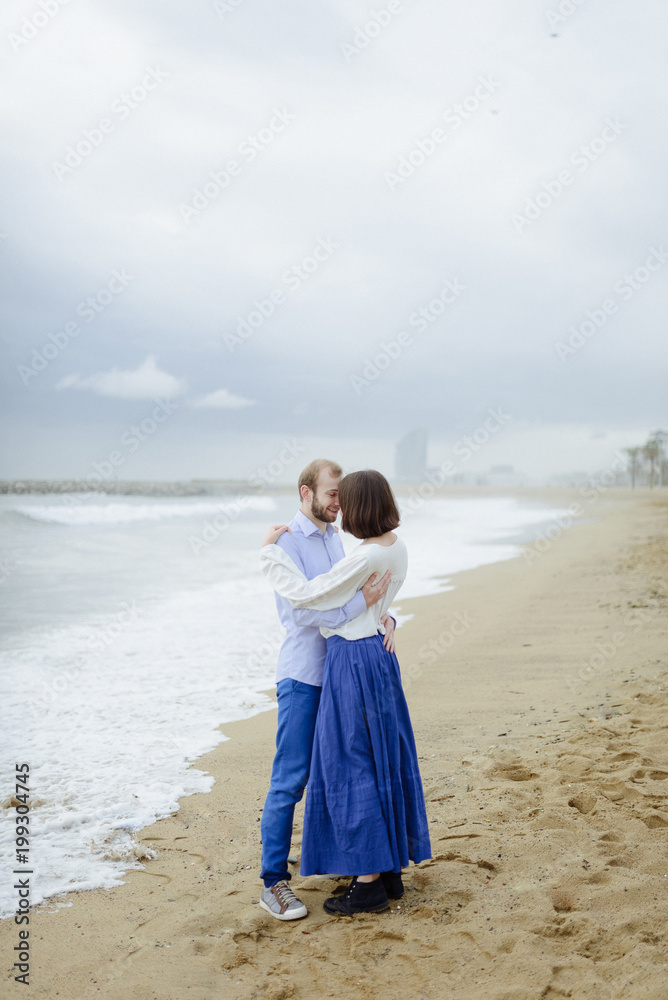 A loving couple, man and woman enjoying summer vacation on a tropical paradise beach with clear sea ocean water and scenic A loving couple, man and woman enjoying summer vacation on a tropical paradise beach with clear sea ocean water and scenic