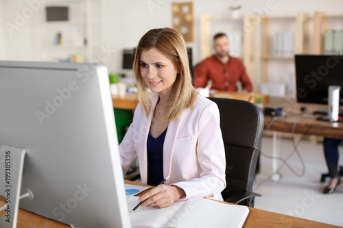 Young woman working in office. Finance trading