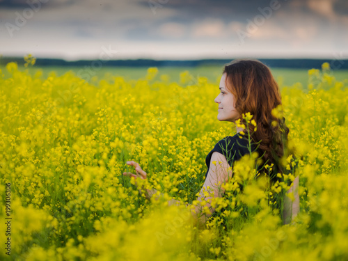 beautiful russian girl in a canola field