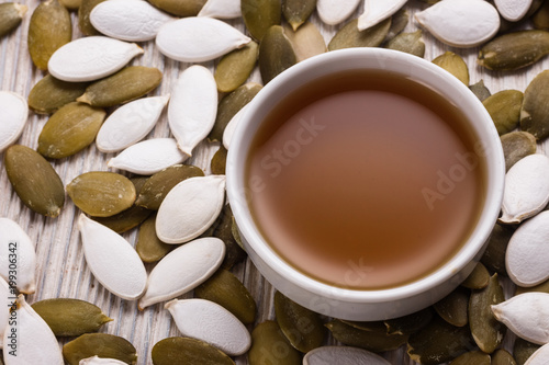 pumpkin seed oil on a rustic background