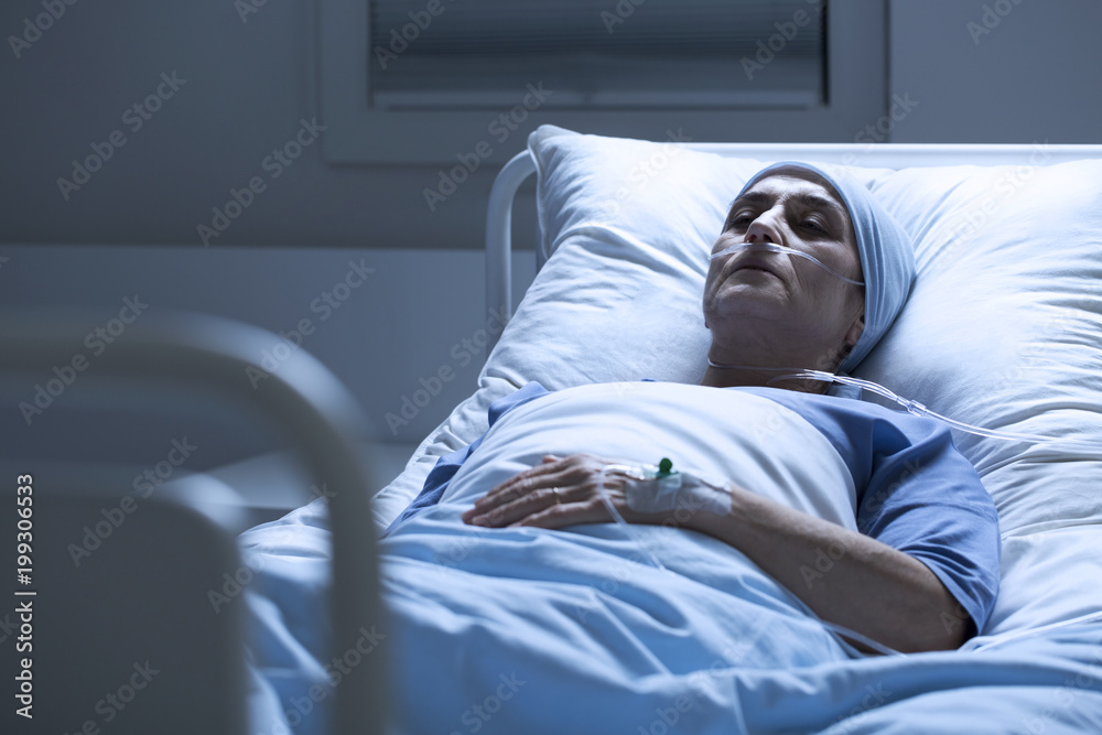 Woman alone in hospital bed Woman alone in hospital bed