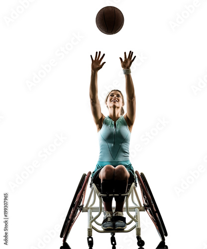 one caucasian young handicapped basket ball player woman in wheelchair sport tudio in silhouette isolated on white background