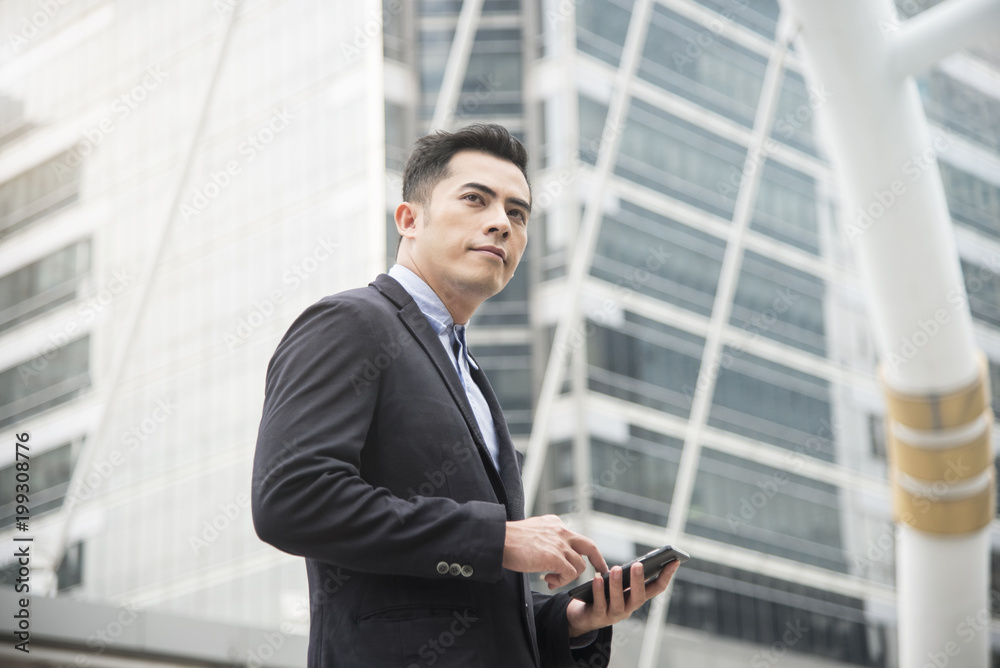 Handsome businessman using mobile phone. concept communication. Handsome businessman using mobile phone. concept communication.