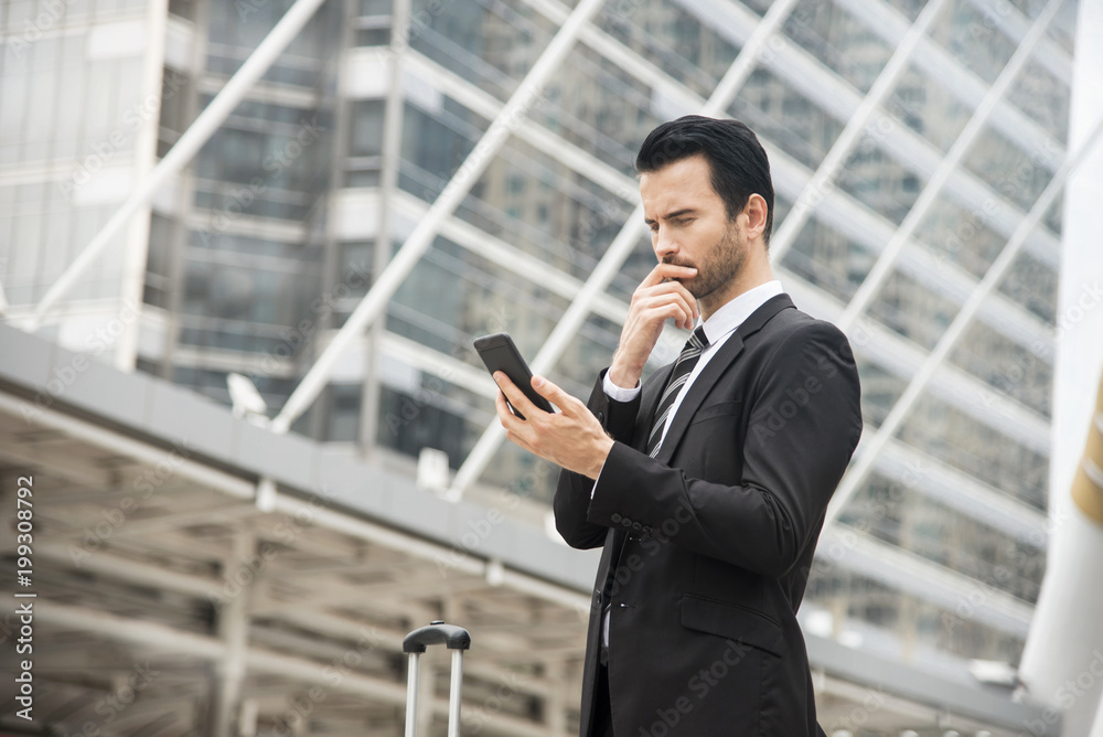 Handsome businessman using mobile phone. concept communication. Handsome businessman using mobile phone. concept communication.