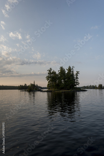 Silhouette of trees on an island, Kenora, Lake of The Woods, Ontario, Canada