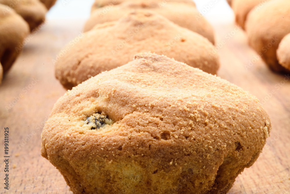 Fototapeta premium Muffins with raisins. Background