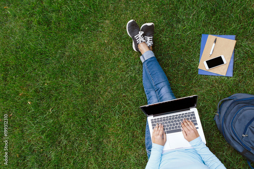 Fototapeta Naklejka Na Ścianę i Meble -  Student studying outdoors.