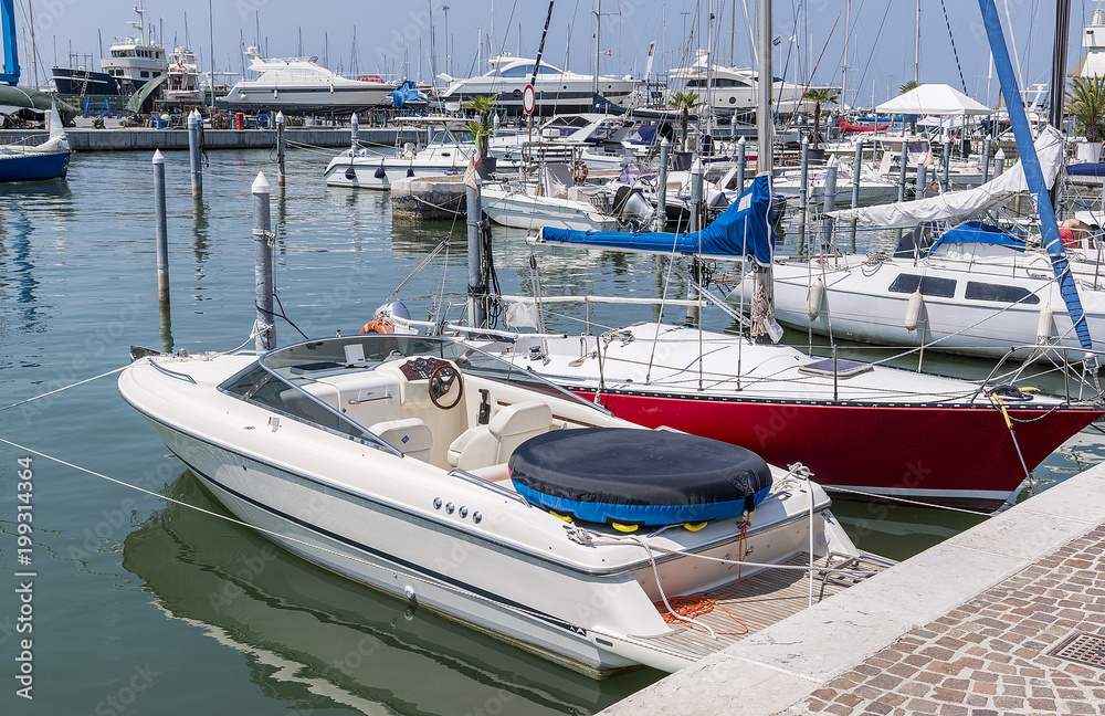 View of the canal with boats and yachts in the Italian city of Rimini .. View of the canal with boats and yachts in the Italian city of Rimini ..