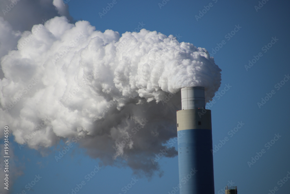 Steam coming out of the chimney at power plant in Rotterdam Maasvlakte in Netherlands