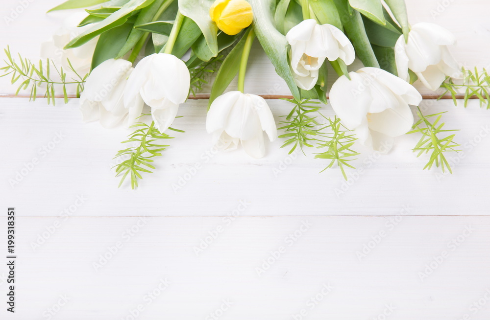 Festive flower white tulips composition on white wooden desk, background. Overhead top view, flat lay. Copy space. Birthday, Mother's, Valentines, Women's, Wedding Day concept.