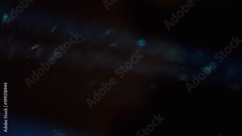 Dust Particle Stream from real projector, Bright and illuminate Macro Close Up View