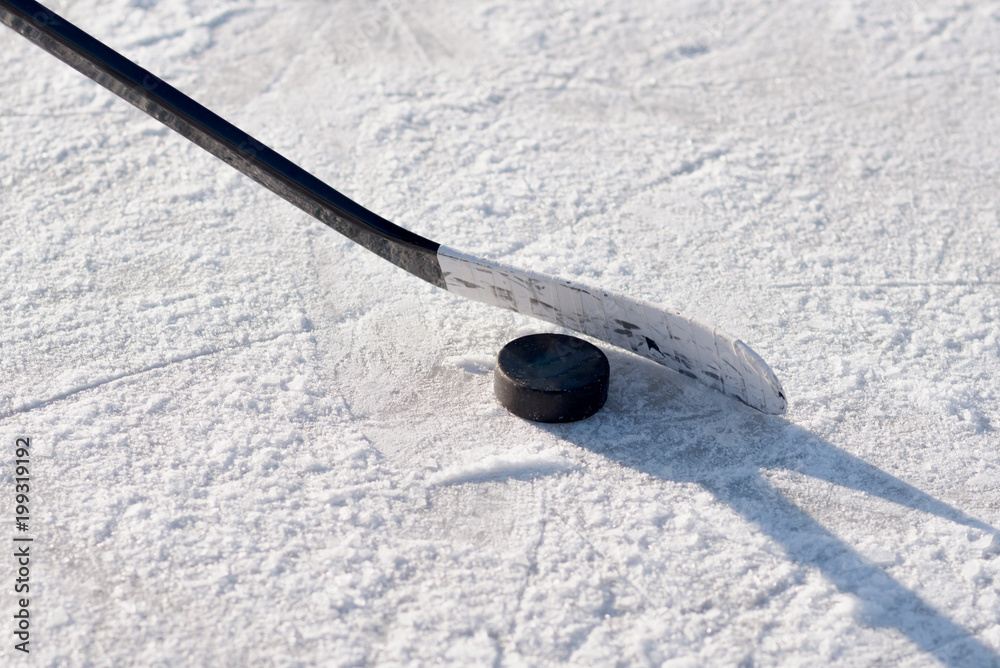 Fototapeta premium close-up of sticks and pucks in the stadium