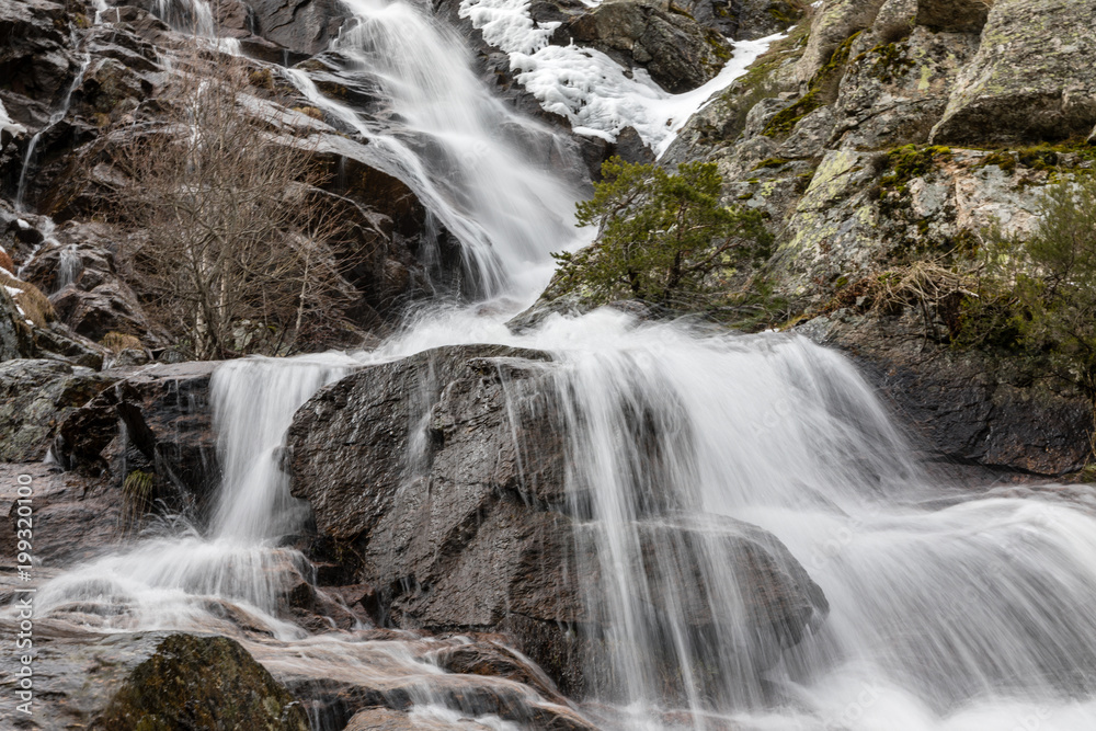 Waterfall from snow melt in the mountains of Madrid, Spain