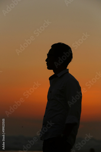 Silhouette of man at sunset