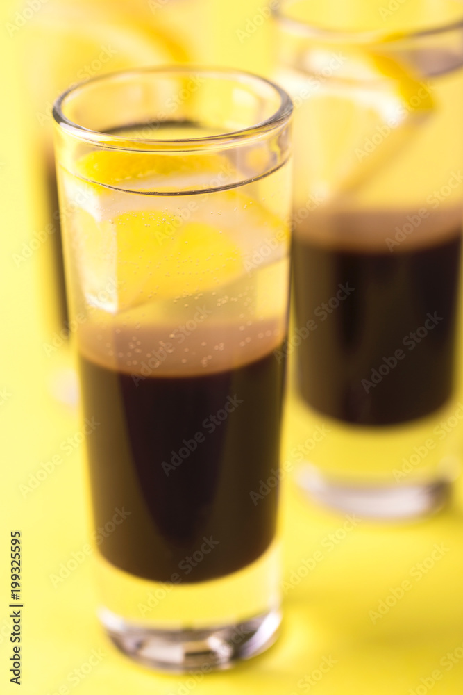 Alcoholic cocktail silver bullet with gin, coffee liqueur and lemon. Alcoholic cocktail silver bullet with gin, coffee liqueur and lemon.