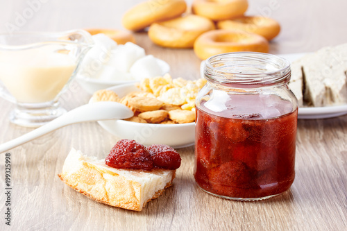 jam in glass cann on wooden table