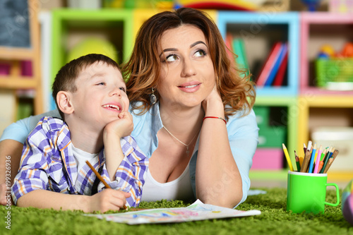 Mother and son painting together 