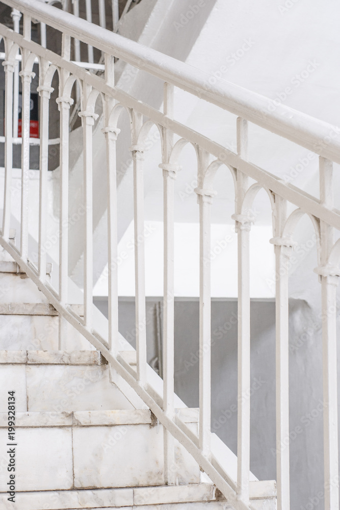 Fototapeta premium Beautiful Marble staircase with white railing leading upwards