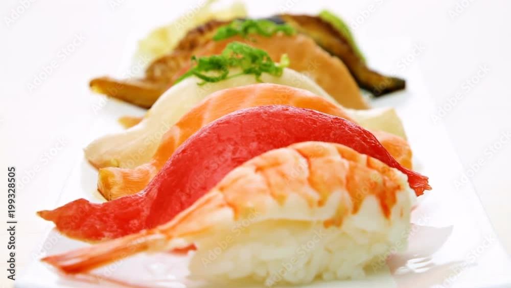 Camera moves pass a plate of sushi. Camera moves pass a plate of sushi.