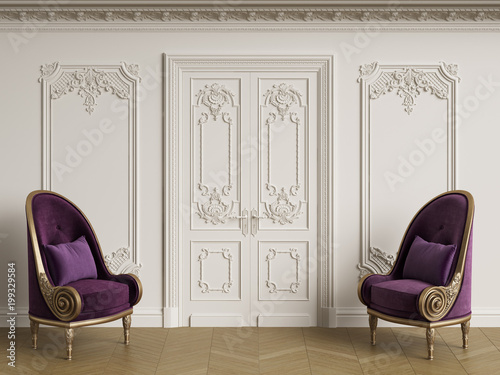 Classic baroque armchais in classic interior. Walls with moldings and decorated cornice