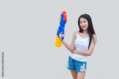 Asian sexy woman with water in hand on white background,Festival songkran day at thailand,The best of festival of thai,Land of smile