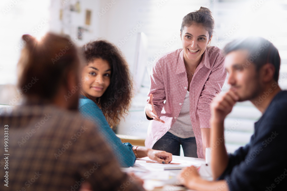 © jackfrog - meeting at the company. A young woman leads a multi-ethnic worki © jackfrog - meeting at the company. A young woman leads a multi-ethnic worki