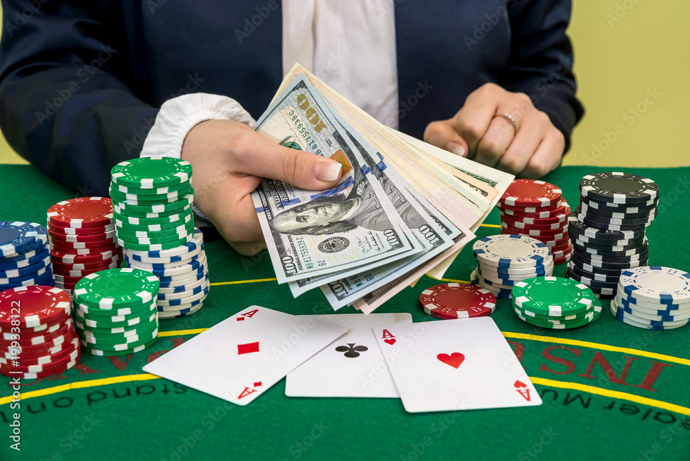 woman win dollar bills, play card and chips