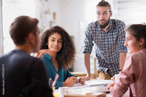 At office. A young man leads a multiethnic working group © jackfrog