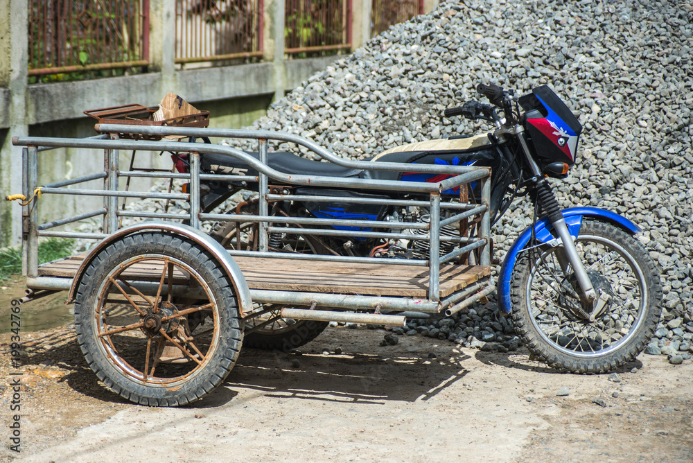 Stockfoto Cargo tricycle on Philippines | Adobe Stock