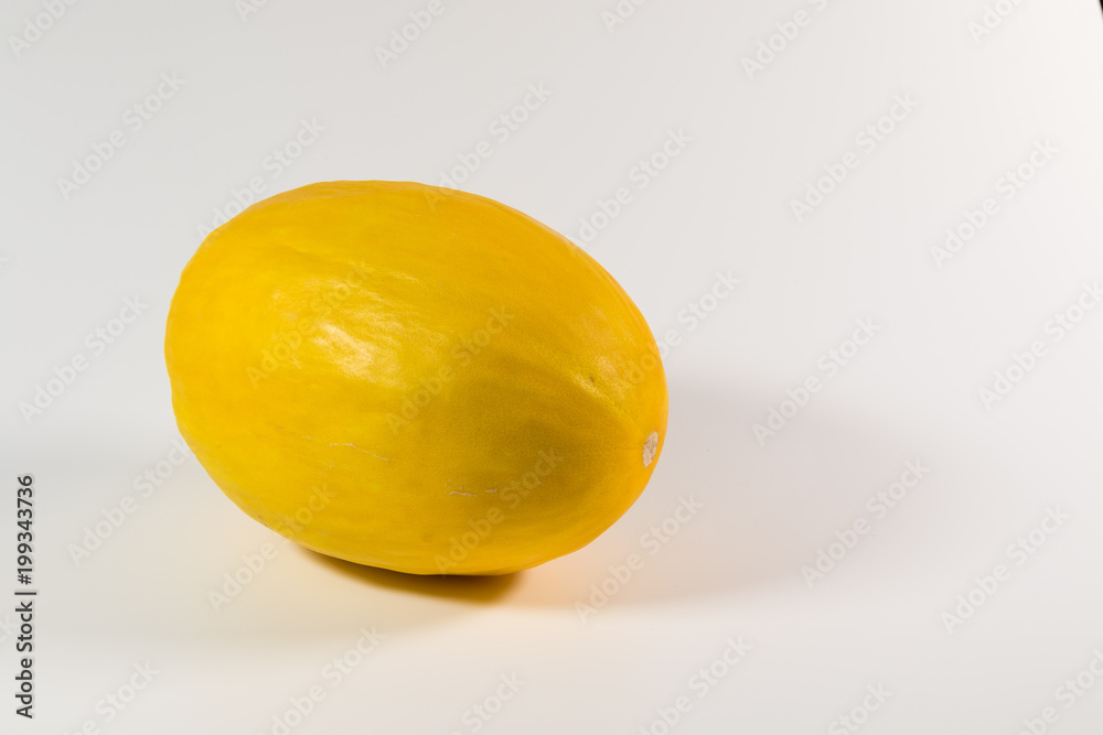 Honey melon in front of a white background Honey melon in front of a white background