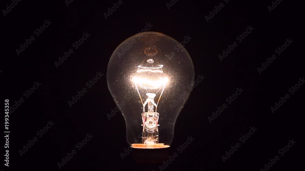 Electric light bulb being dimmed from full brightness to off