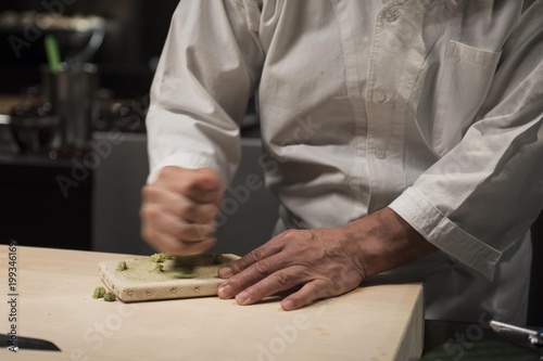 Chef grinding wasabi photo