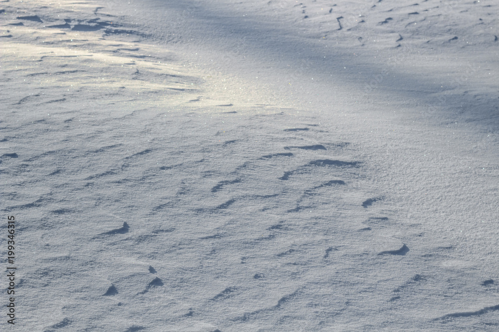 White background with snow ripples on snow in winter
White background with snow ripples on snow in winter