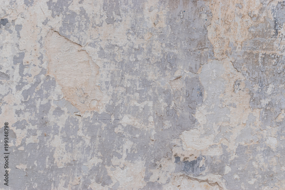 Fototapeta premium Old white concrete wall with cracks and chipped texture