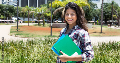 Beautiful caucasian female student laughing at camera photo