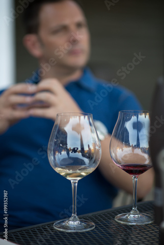 wine glasses in front of man