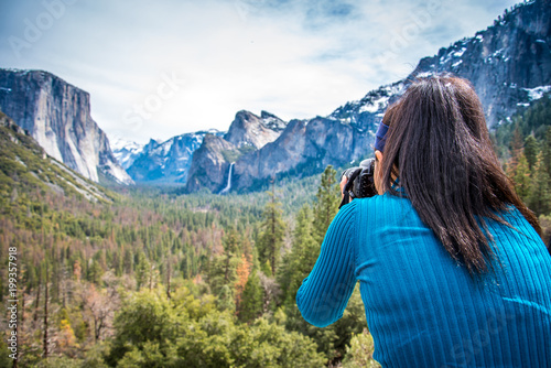 Taking a picture of the snow capped mountains at Tunnel View Yosemite National Park 