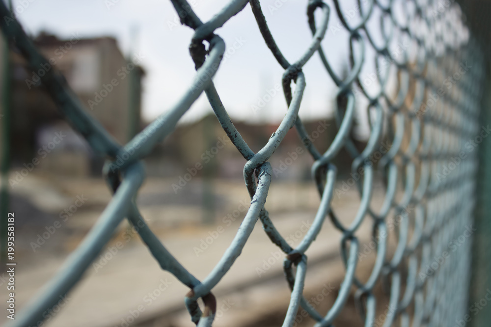 metal fence concept with building construction yard on background metal fence concept with building construction yard on background