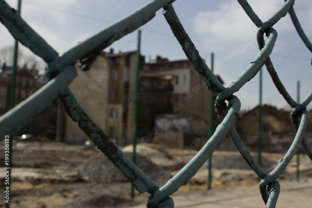 metal fence concept with building construction yard on background metal fence concept with building construction yard on background